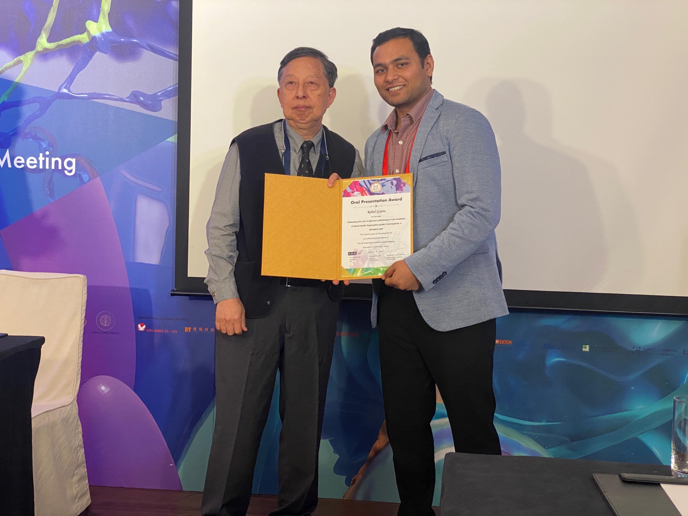 Dr Rahul Gupta receiving the Oral Presentation Award at the 4th International Rhoton Society Meeting, Taipei, 2024